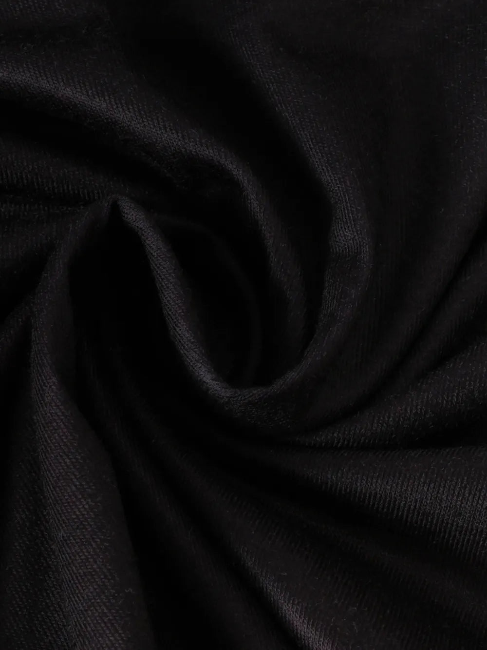 Black fabric in a swirling pattern, showcasing a soft, textured surface.