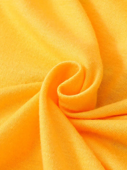 Bright yellow fabric displayed in a soft, curled texture, emphasizing its smoothness and color.