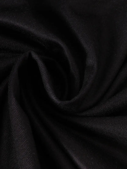 Black fabric in a swirling pattern, showcasing a soft, textured surface.