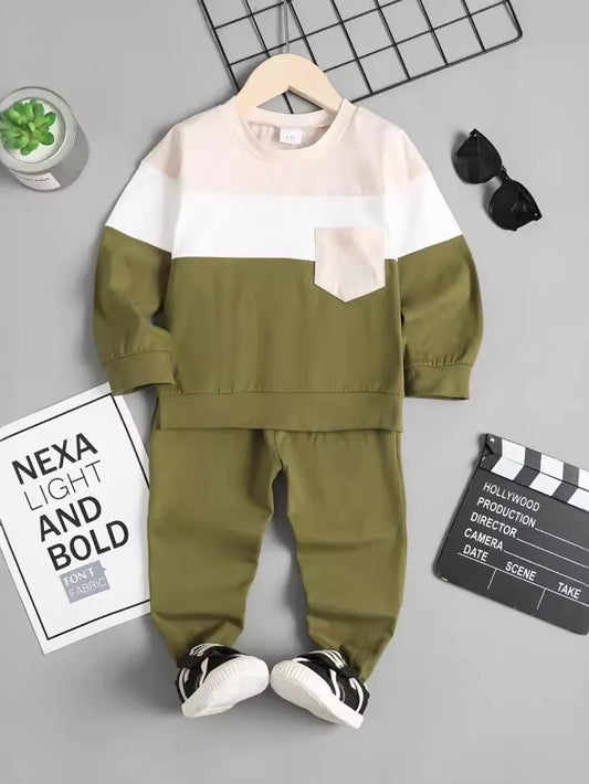 Olive green and white toddler outfit displayed with sunglasses and a film clapperboard.